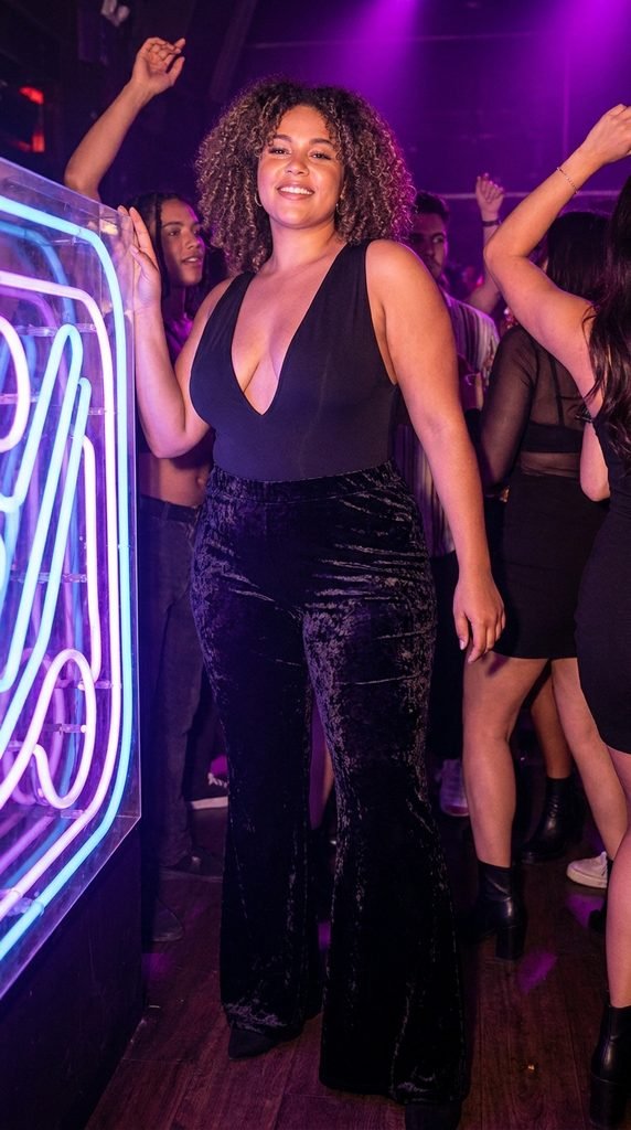 Flare Velvet Pants Paired with a Plunging Bodysuit