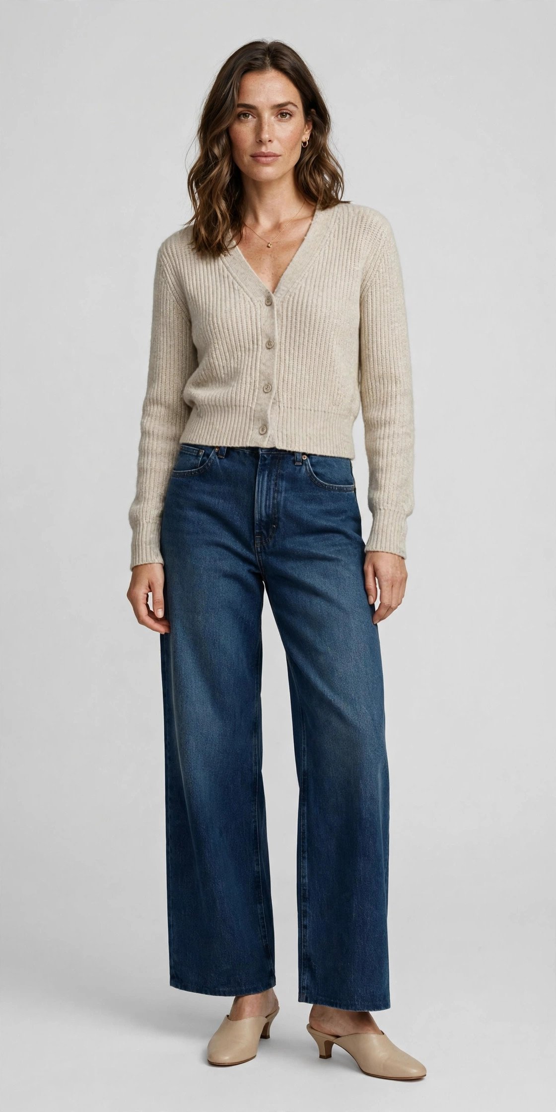 Woman in wide-leg jeans and a cropped cardigan