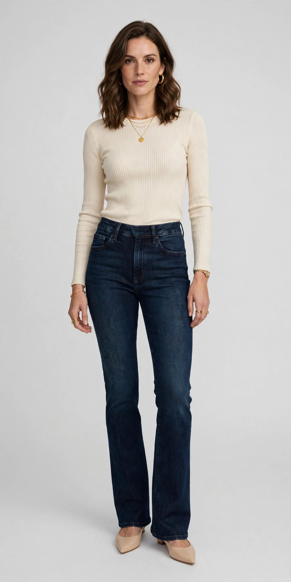 Woman in bootcut jeans and pointed-toe flats