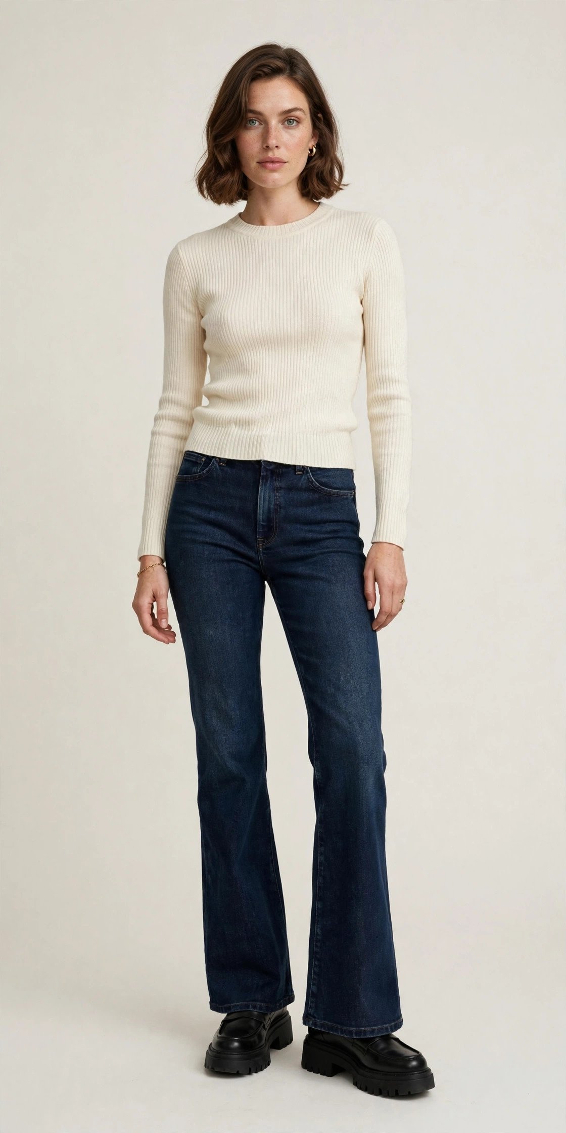 Woman wearing flared jeans with chunky loafers