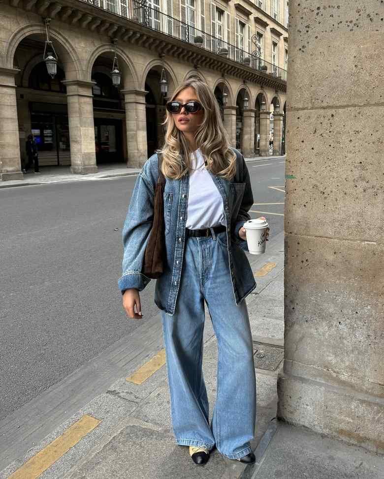 Woman in double denim outfit jeans and denim shirt travel style