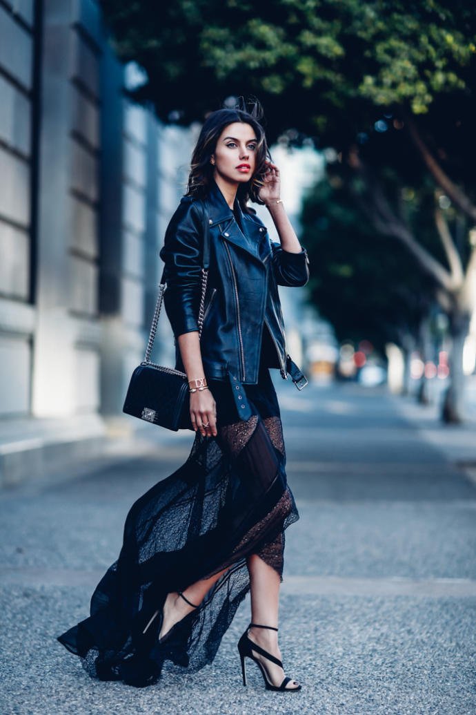 Woman in maxi dress with leather jacket travel outfit