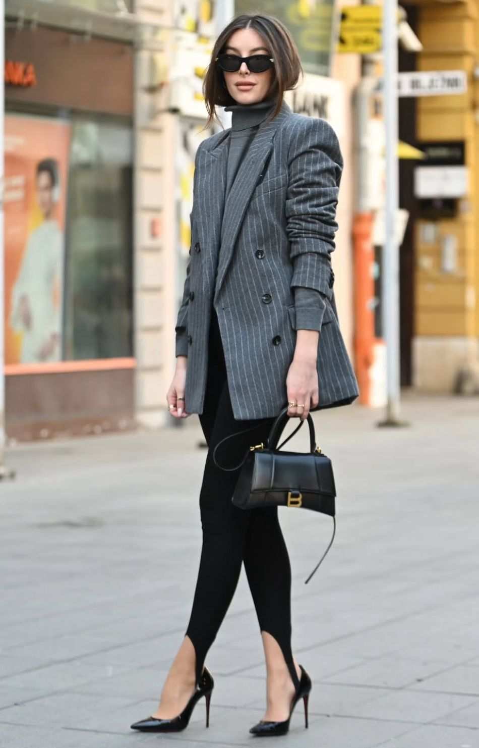 Woman in blazer with leggings at airport business casual