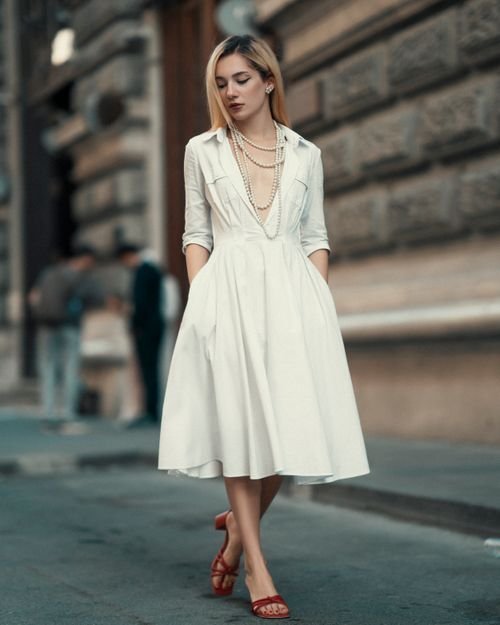 Elegant woman in white dress romantic travel outfit