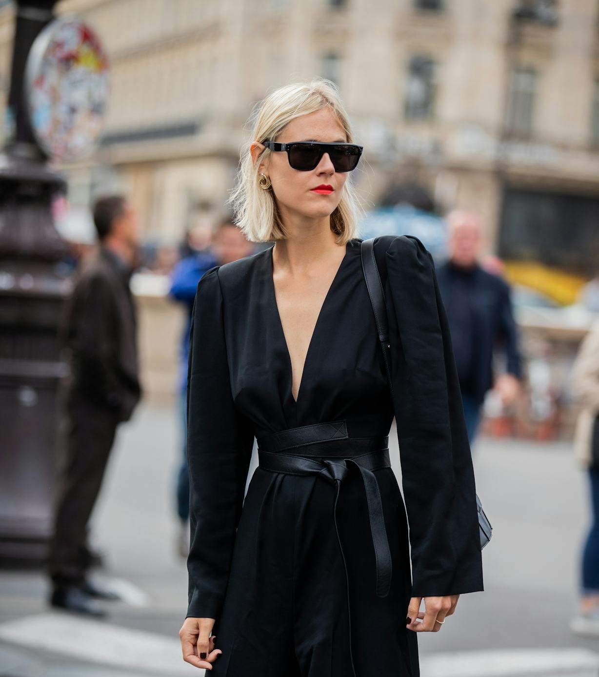 Romantic couple at night woman with red lip all black outfit