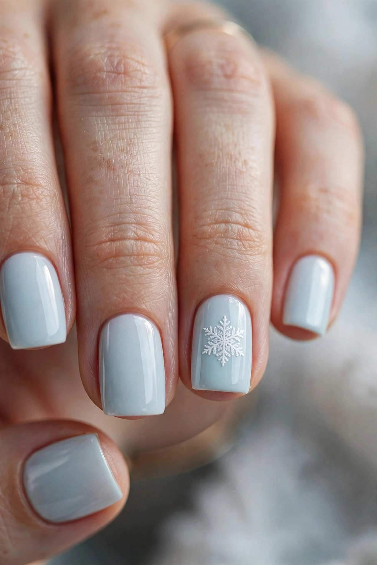 Short square nails with snowflake decals