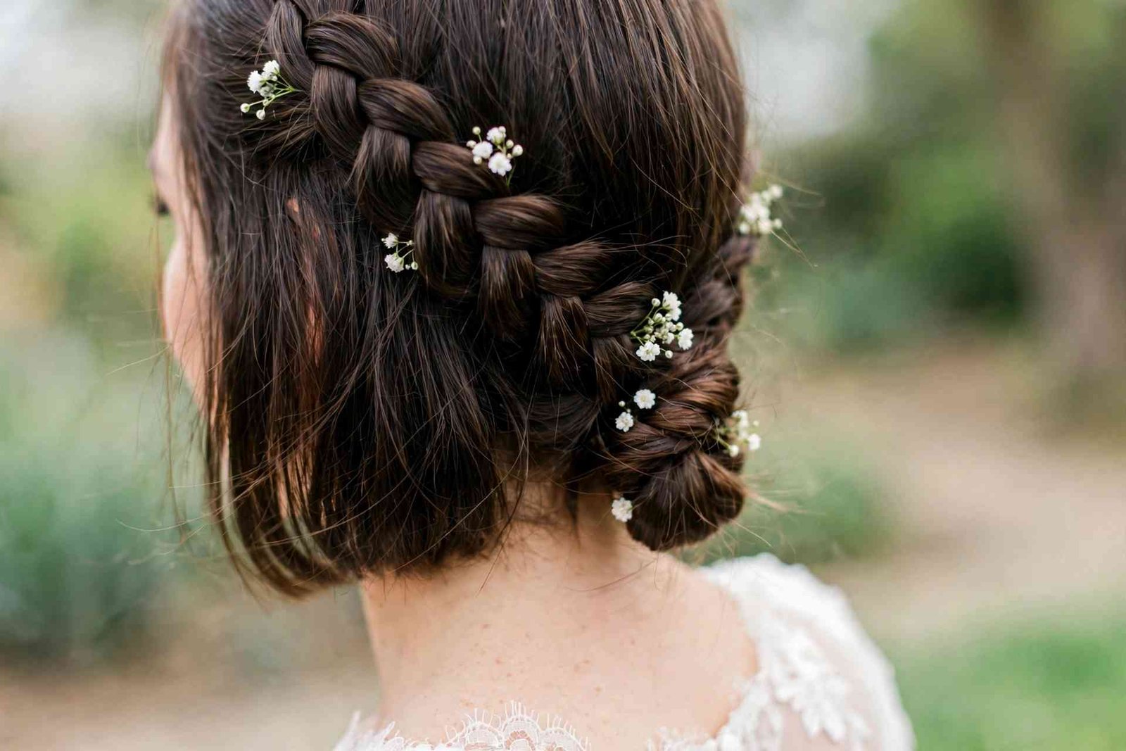 Side Dutch braid into low bun hairstyle
