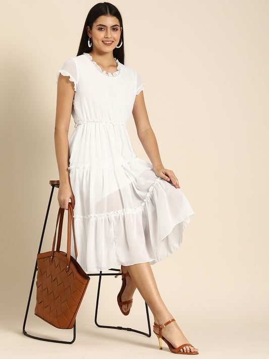 Woman in a tiered midi dress with beautiful movement