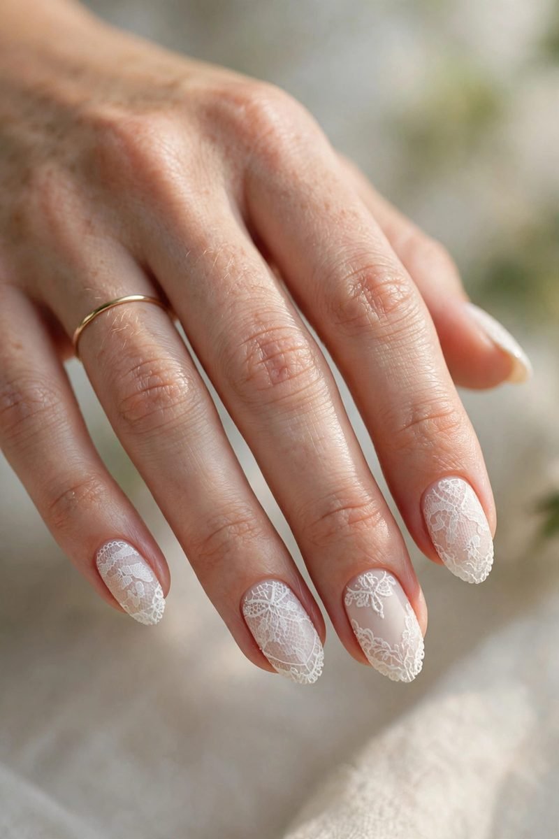 Ivory lace almond nails for a wedding