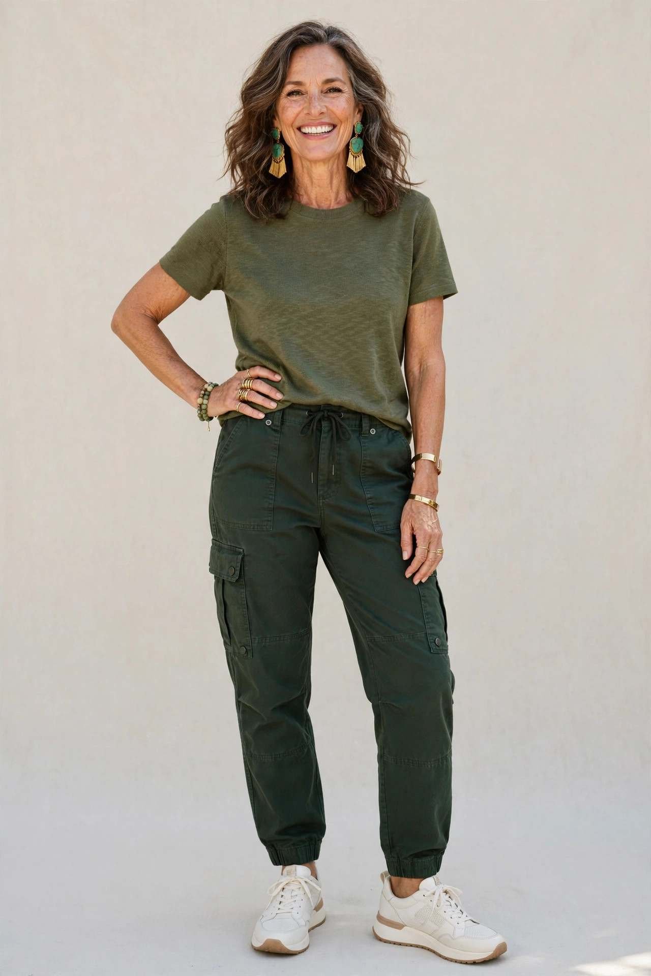 Confident woman over 50 in green cargo pants outfit