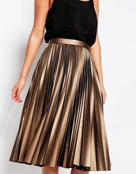 Woman in a metallic pleated party outfit