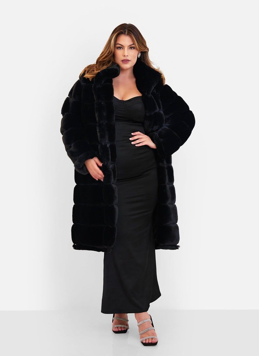 Woman in fur coat and high heels in dramatic red light