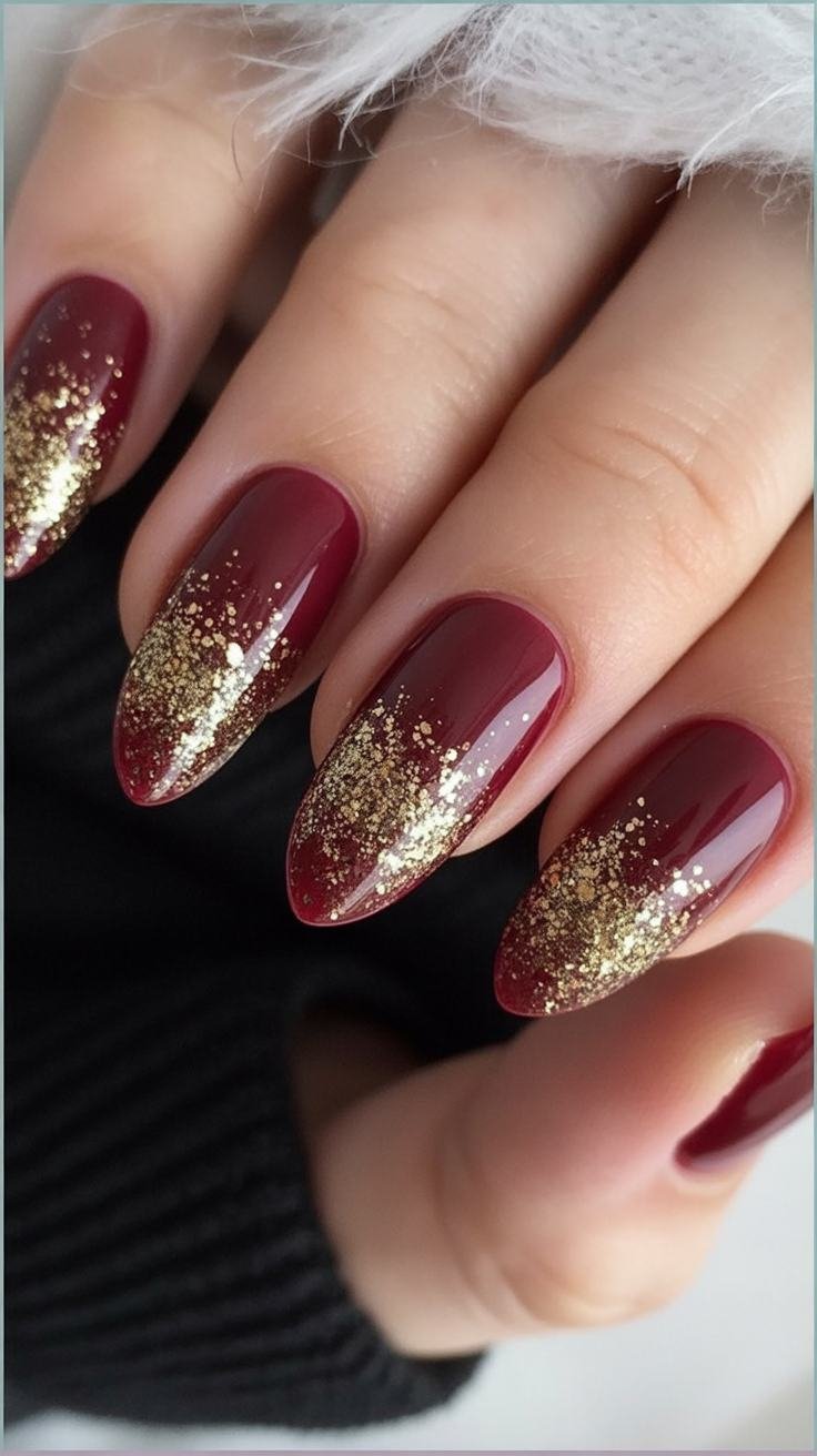 Burgundy nails with gold sparkle