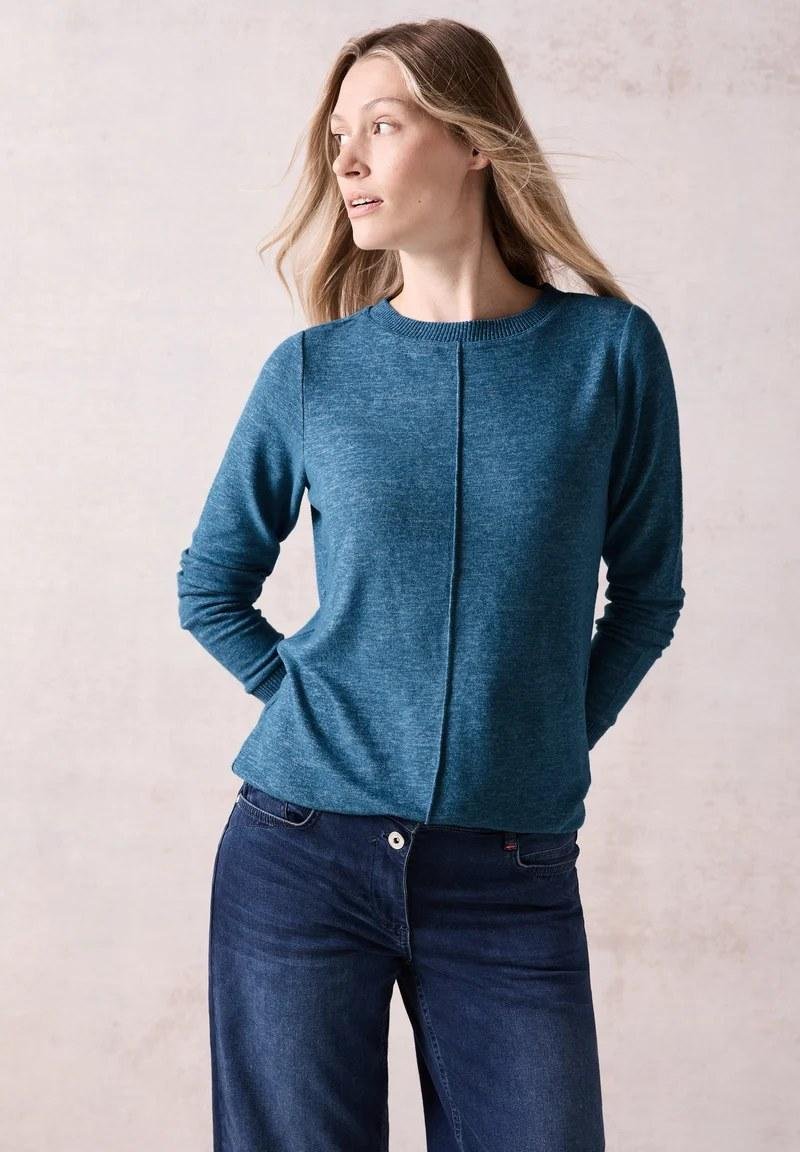 Teal sweater with dark wash jeans