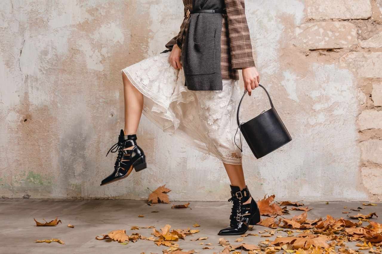 Woman in heeled leather boots and jeans