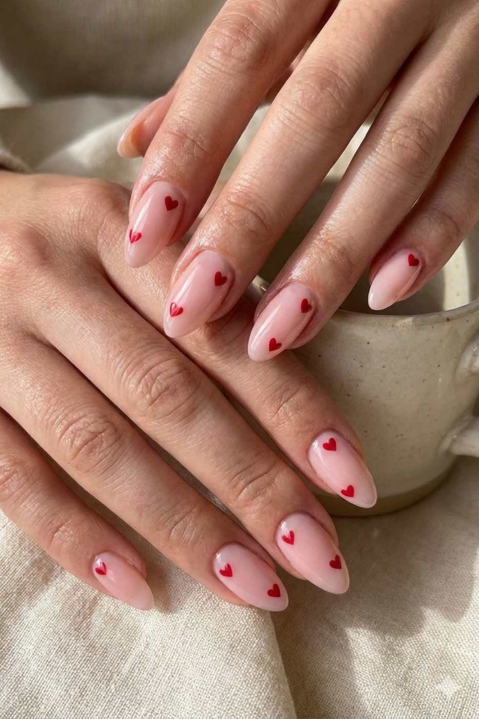 Nude nails with tiny red heart