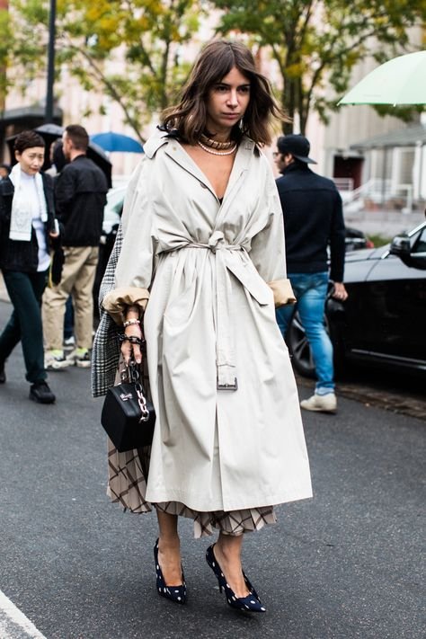 Woman wearing belted trench coat as dress