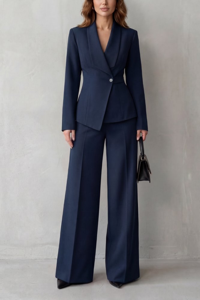Woman in black trench coat with tailored blazer and trousers
