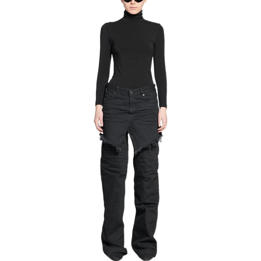 All black mini skirt over black jeans outfit