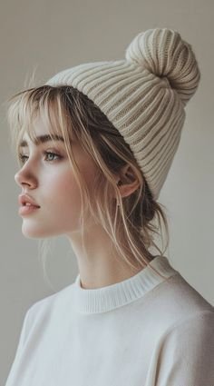 Messy bun worn casually under a winter beanie