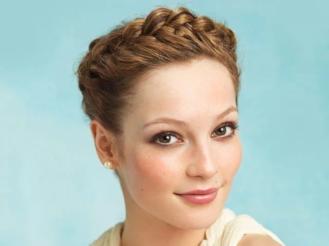 Milkmaid braids pinned across the crown