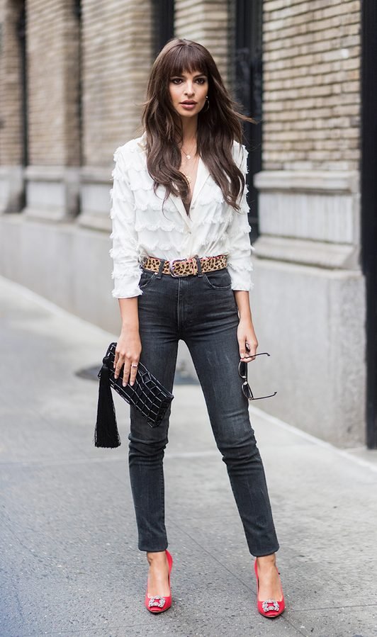 Flare jeans with an off-shoulder top and statement belt