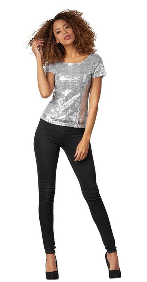 Sequin camisole tucked into dark flare jeans