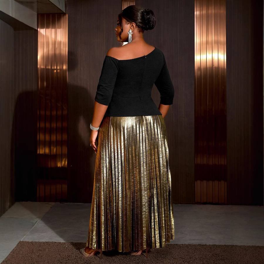 Gold pleated midi skirt with a black bodysuit