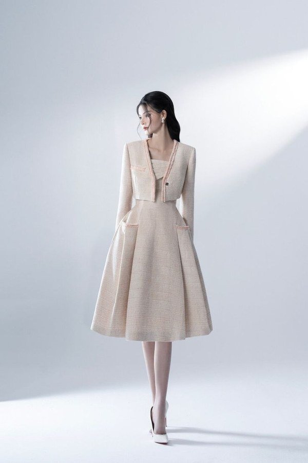 Tweed jacket with a silk midi skirt