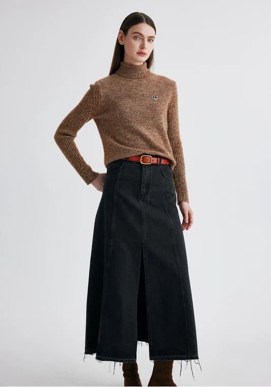 Woman in a turtleneck with a dark denim maxi skirt