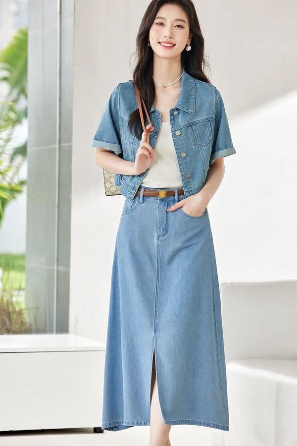 Woman wearing a matching denim jacket and denim skirt set