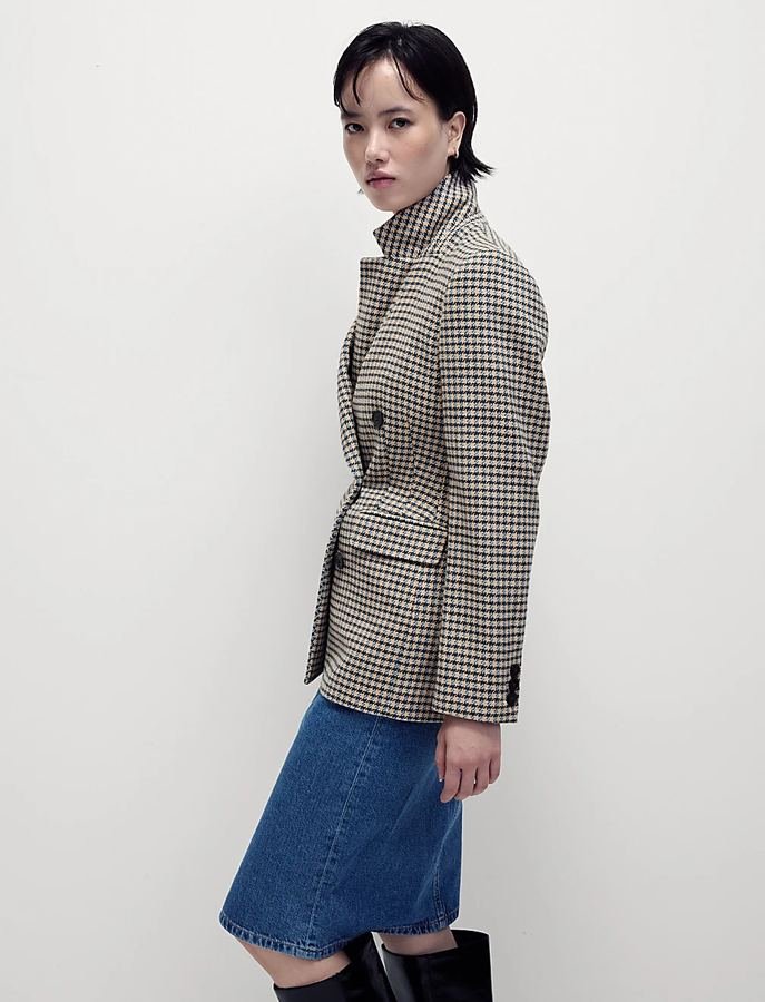 Woman in a tweed blazer with a denim midi skirt