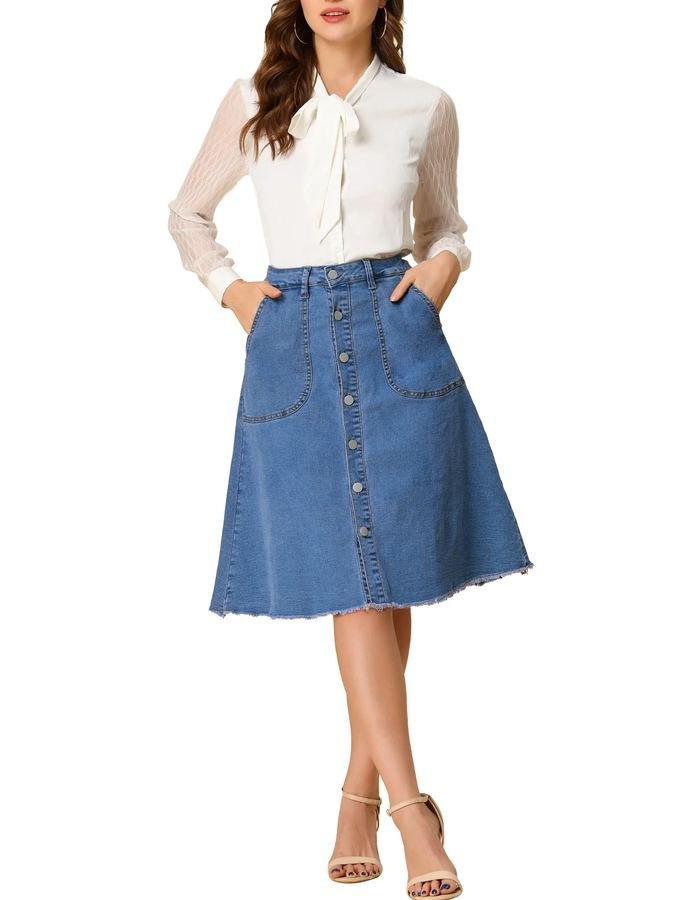 Woman in a pointed-collar blouse with a button-front denim midi skirt