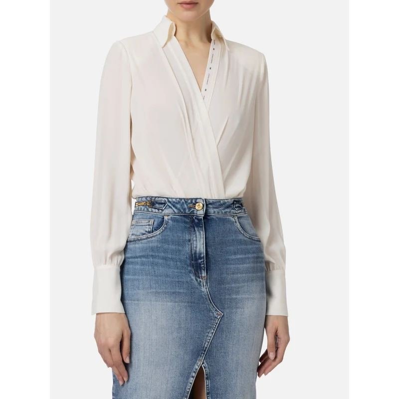Woman in a wrap blouse with a denim pencil skirt