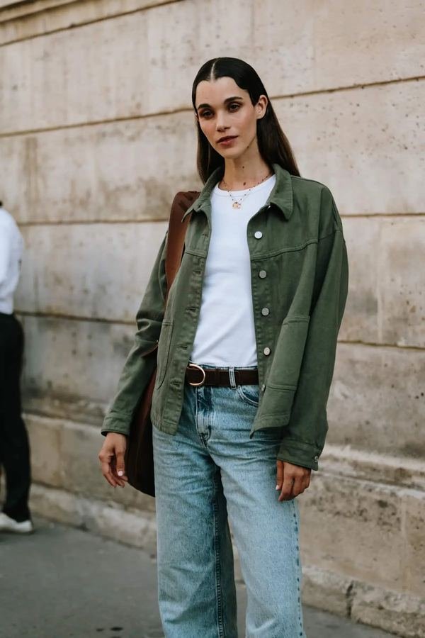 Woman in a utility jacket with white tee and jeans