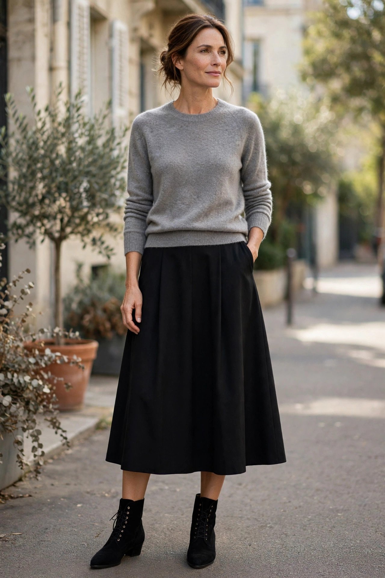 Black A-line midi skirt with cashmere crewneck sweater