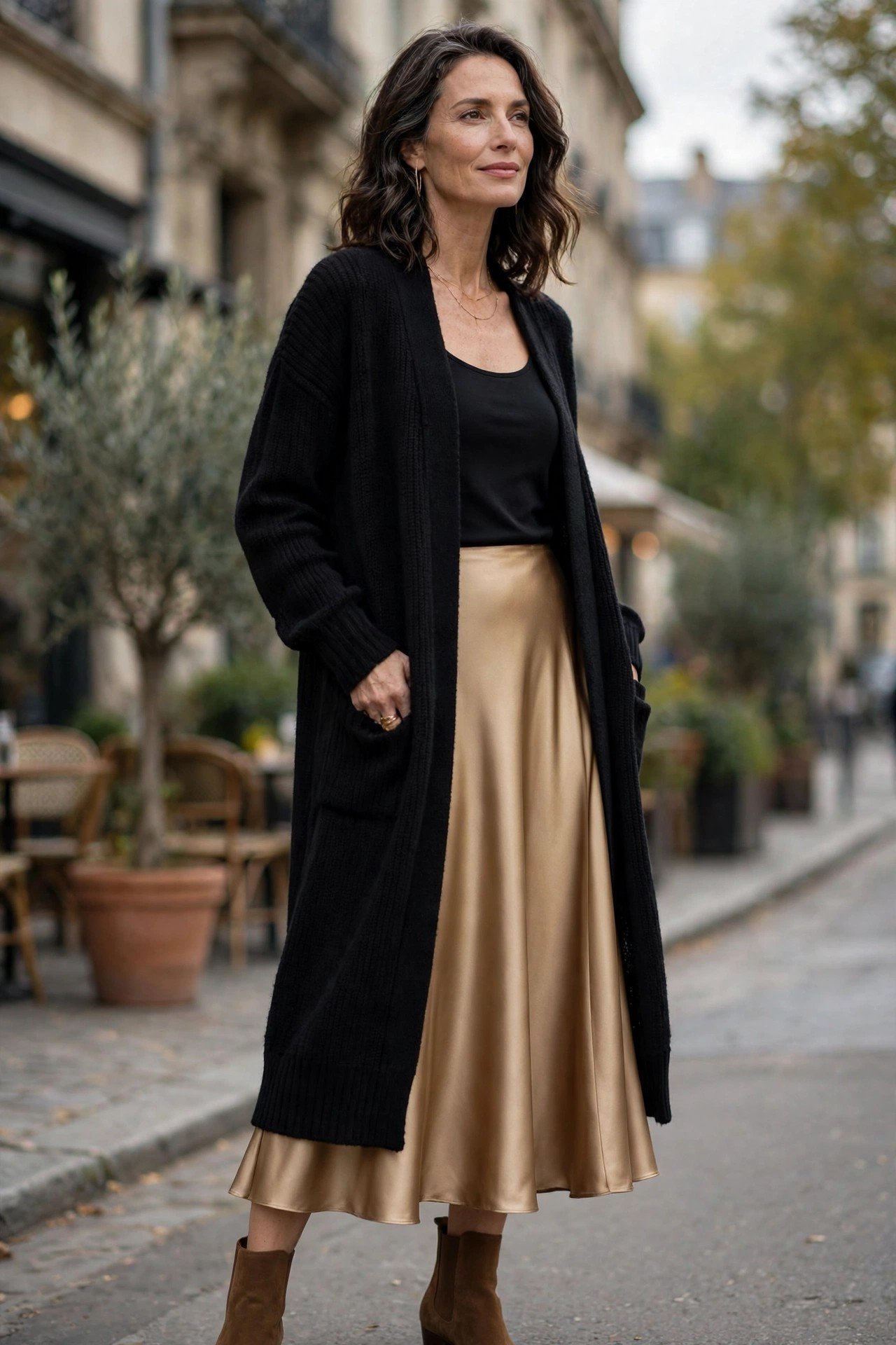 Woman in a long cardigan with a satin skirt