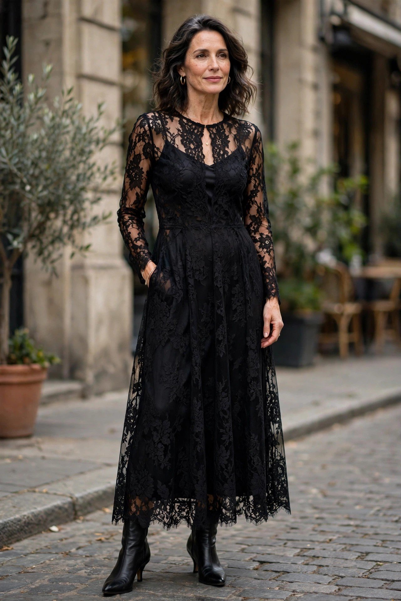 Woman in black lace overlay dress