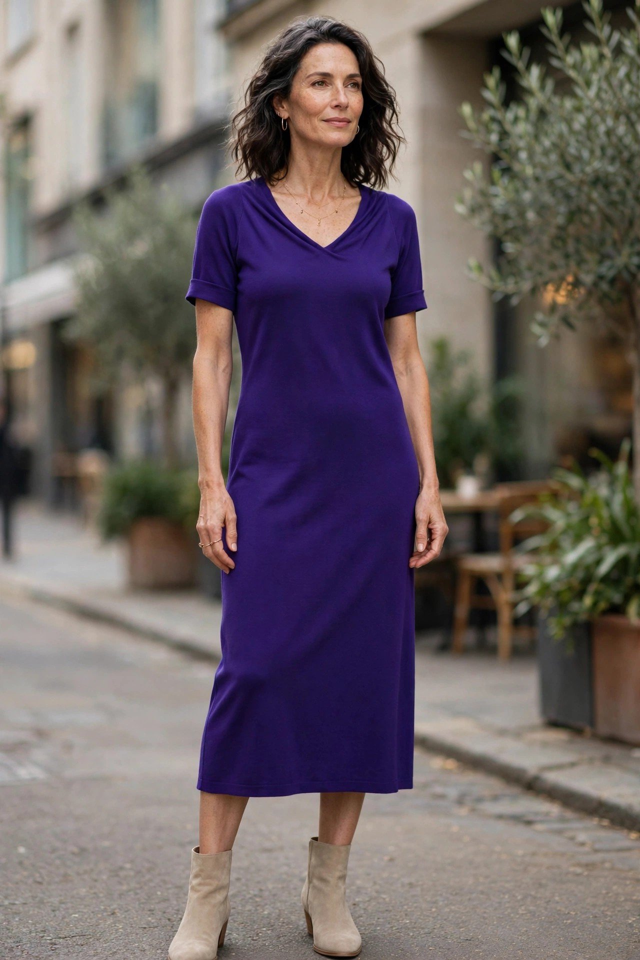 Woman in royal purple midi dress
