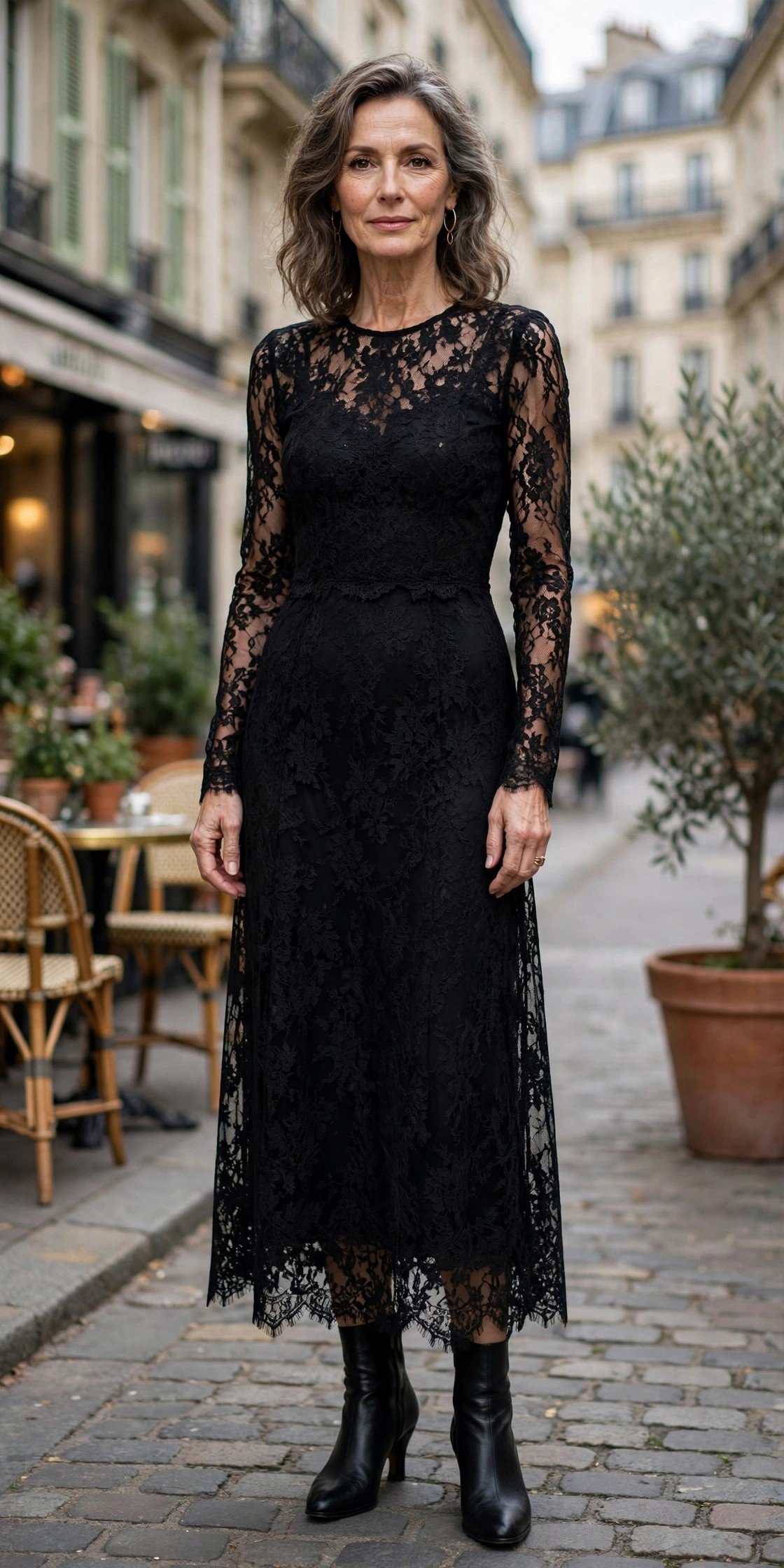 Woman in a black maxi dress with lace sleeves