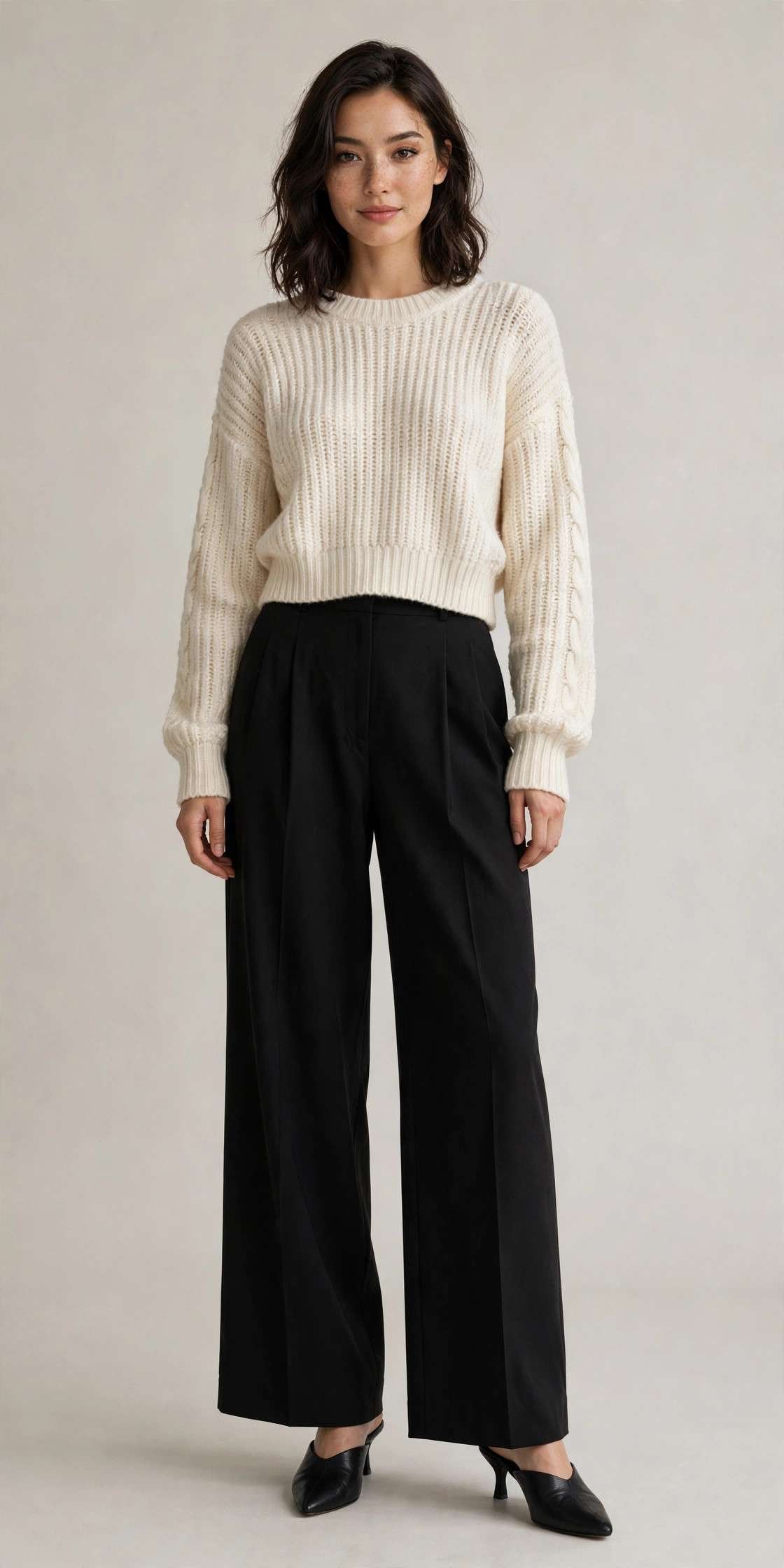 Woman in wide-leg trousers with a cropped sweater