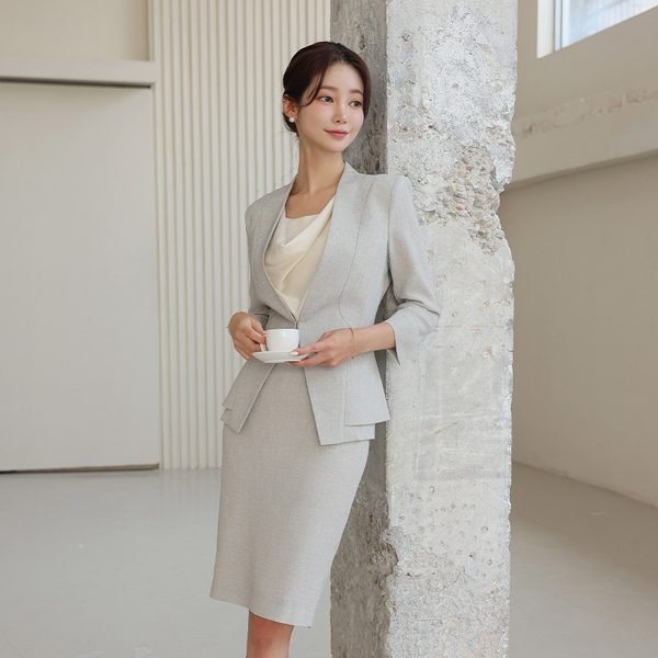 Woman wearing a cowl-neck blouse with a tailored skirt
