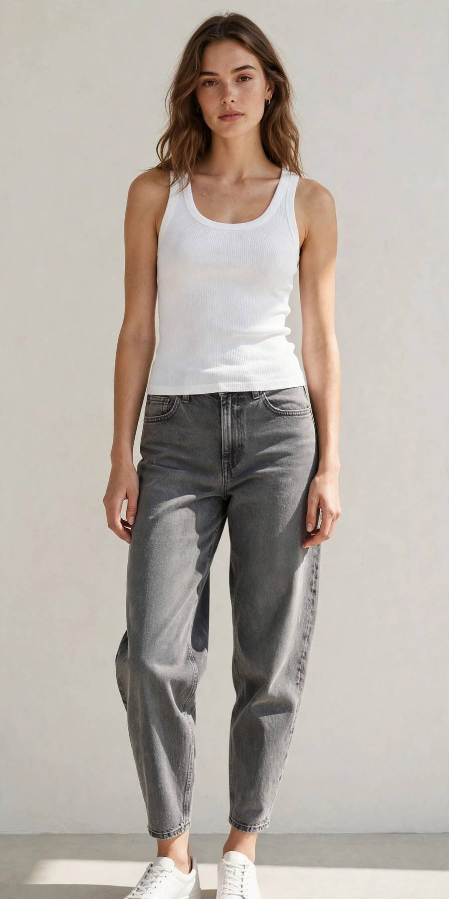 Woman in gray barrel jeans with fitted ribbed tank